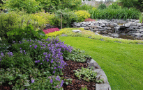 Back Yard Garden with Waterfall, Rock Wall, Patio, Flowering Perennials and Shrubs